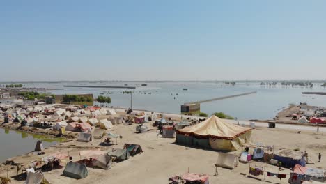 Aerial-Flying-Over-Of-Makeshift-Camps-For-Flood-Disaster-Victims-In-Maher,-Sindh