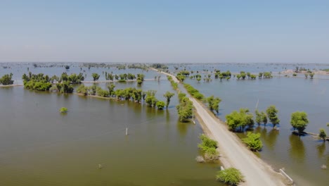 Aerial-View-Of-Road-Through-Flooded-Landscape-In-Maher,-Sindh