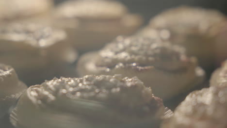 Close-up-of-cinnamon-buns-getting-baked-in-the-oven