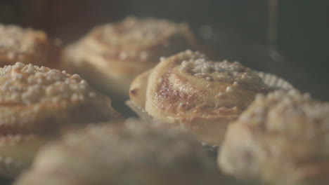 Close-up-of-cinnamon-buns-getting-baked-in-an-oven