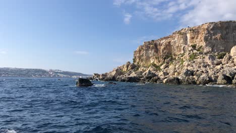 cruising-on-Mediterranean-Sea-with-sunshine-over-rocky-coastline