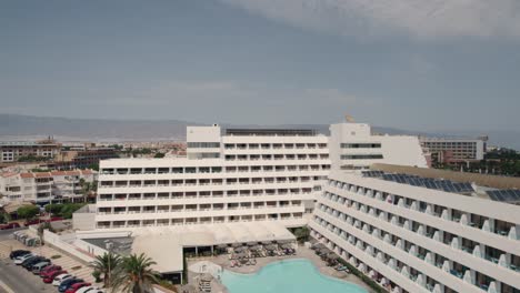 Aerial-pull-away-view-from-holiday-destination-hotel-to-the-sea-in-Almeria-Spain