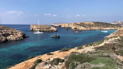 luxury-sail-boat-yacht-moored-in-comino-bay-island-during-a-sunny-day-of-Summer