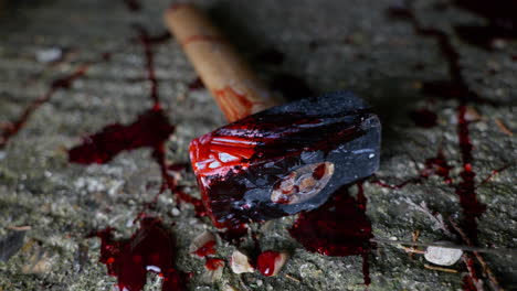 A-bloody-lump-hammer-lies-on-a-grimy-concrete-floor-surrounded-by-blood-splatters