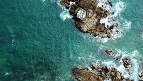 Rocks-in-the-pacific-sea,-uhd-4k-aerial