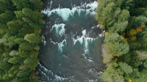 Aerial-shot-of-River-Rapids-Slowing-Flying-Along-River