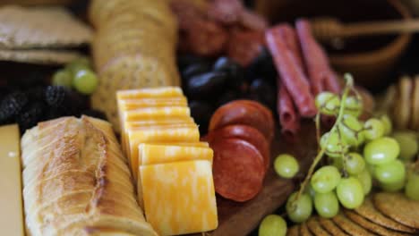 Honey,-Meat,-Crackers,-Cheese,-and-Bread-on-Fancy-Charcuterie-Food-Board