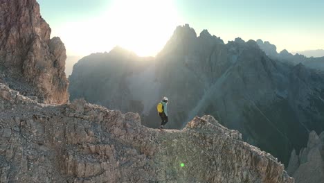 Female-hiker-walking-along-the-ridge-in-the-Dolomites