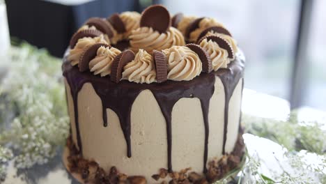 Chocolate-Peanut-Butter-frosting-with-Reese's-Cups-on-Delicious-Cake