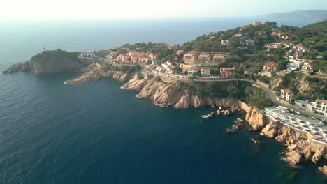 Aerial-image-of-the-cliffs-of-Sant-Feliu-de-Guíxols-on-the-Costa-Brava-in-Girona-luxury-property-high-standing-houses-on-the-seafront