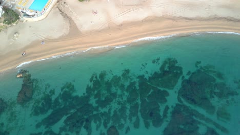 Aerial-shot-of-an-impressive-beach-with-transparent-water-on-the-Costa-Brava-in-Girona-Playa-de-Aro-and-S'Agar?