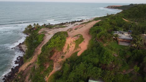 Sunset-Lookout-Spot-in-Cliffside-Sand-Dunes-in-Pipa-Brazil-Overlooking-City-and-Beaches-during-High-Tide