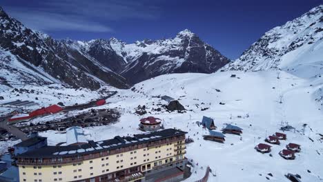 Panoramic-view-of-Ski-station-centre-resort-at-snowy-Andes-Mountains-near-Santiago-Chile