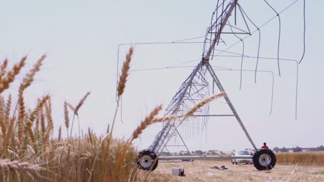 Machine-used-for-Center-Pivot-Irrigation-System-kept-in-a-farm-in-Pakistan-in-a-sunny-day