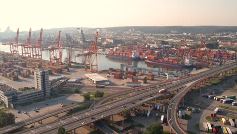Aerial-Port-of-Gdansk---Logistics,-Global-Trading,-Transport,-Shipping-Container-Terminal,-Poland-at-Sunrise