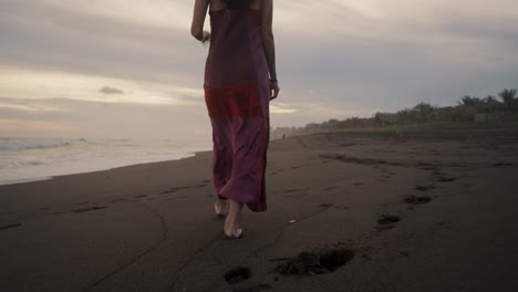 Slow-Motion-Of-A-Woman-On-The-Sandy-Shore-Walking-Barefooted