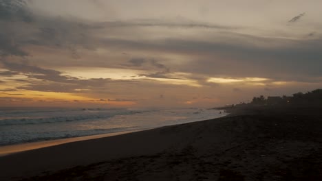 Tilt-down-On-Sunset-Seascape-Of-El-Paredon-Surfing-Beach-In-The-Province-Of-Escuintla,-Guatemala