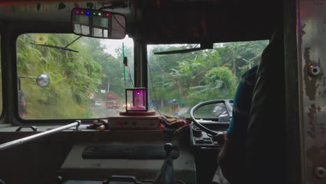Windscreen-Wipers-Going-On-Sri-Lankan-Bus-on-a-Rainy-Day-Driving-Fast-Down-Rural-Roads