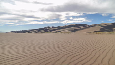 Slow-Pan-Up-of-Great-Sand-Dunes-Perfectly-Wind-Shaped-Sand
