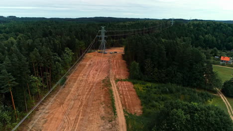 Drone-following-the-trajectory-of-high-voltage-cables-passing-in-dense-forest