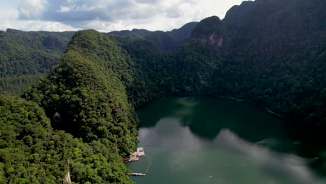 Tranquil-Lake-Is-Surrounded-By-Mountains-With-Lush-Forest-In-Dayang-Bunting-Island,-Langkawi,-Malaysia