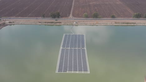 Aerial-view-of-Floating-solar-panels-in-a-small-pond