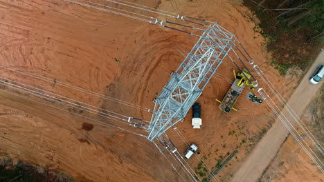 Aerial-top-down-view-of-new-high-voltage-tower-recently-installed-in-the-forest