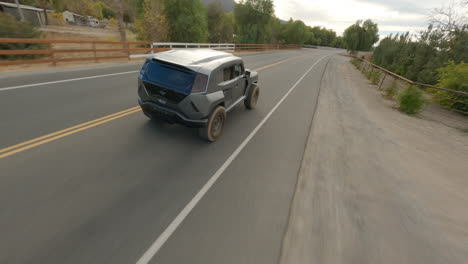Cinematic-FPV-drone-chasing-shot-of-a-futuristic-police-car
