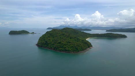 Beautiful-scenic-drone-flight-around-Beras-Basah-Islands,-archipelago-in-Malaysia