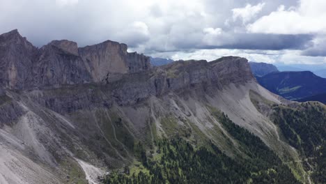 Iconic-Seceda-ridgeline-in-Italian-Dolomites---aerial-view-on-overcast-day