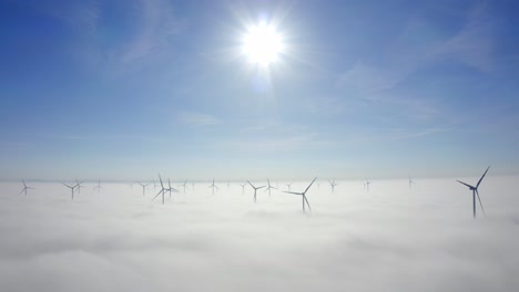 Wind-Turbines-In-The-Fog-During-Sunrise