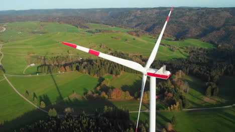 Three-black-Forest-windmills-in-a-left-turn-areal-scenic-fly-by-in-4k