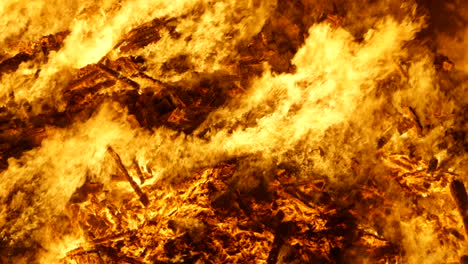 A-huge-bonfire-burns-furiously,-with-huge-flames-close-up,-on-Guy-Fawkes-night,-the-5th-of-November-in-Cinema-4K