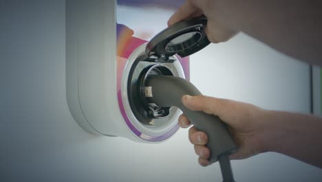 Close-Up-Of-Person-Opening-Cover-Up-To-Connect-Into-Home-Wall-Electric-Charge
