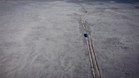 Tracking-Shot-Of-Vehicle-Driving-In-Volcanic-Wide-Empty-Desert,-Iceland