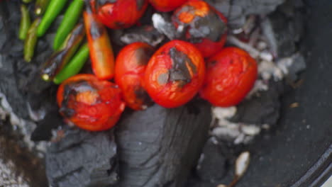 Slow-Motion-Close-up-of-Tomatoes-and-Chillies-on-BBQ-with-Smooth-Pan
