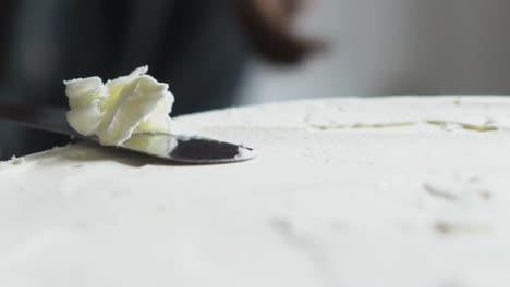 baker-trimming-top-of-cake-slow-mo
