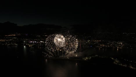 Stunning-Aerial-Drone-footage-of-a-firework-display-on-Plymouth-waterfront,-United-Kingdom