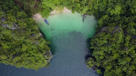 Aerial-Drone-flight-over-Paradise-Island-with-Longtail-Boat,-Krabi,-Thailand