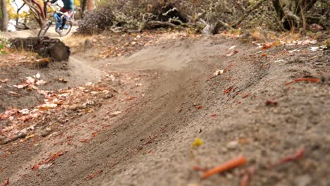 Slow-motion-close-up-of-mountain-bike-tire-sliding-down-a-turn