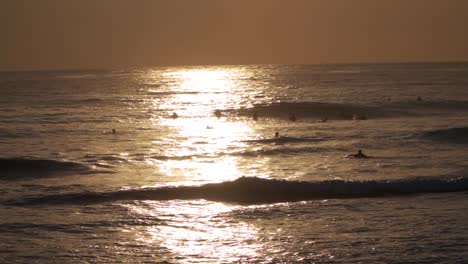 Surfers-waiting-for-waves-at-dusk---SLOMO
