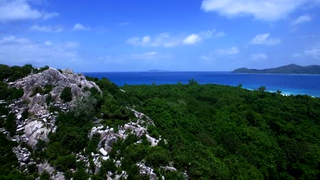 Aerial-Fly-Over-Cousin-Island-in-the-Seychelles-on-a-clear-blue-calm-day