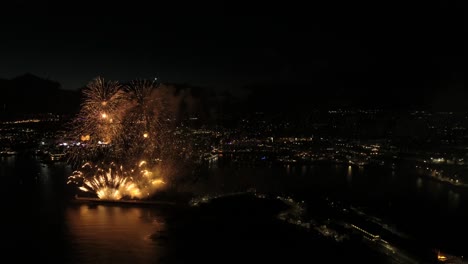 Stunning-Aerial-drone-footage-of-firework-display-on-Plymouth-waterfront,-United-Kingdom