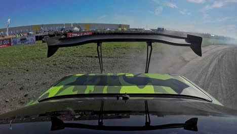 POV-shot-of-a-race-drifting-car-with-smoking-tires-and-challenge,-spoiler
