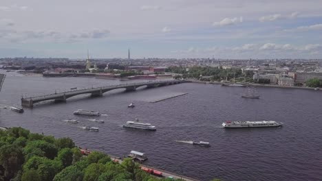 Saint-Petersburg,-an-aerial-drone-footage-of-an-open-bridge-in-Neva-river,-boats-in-a-river,-channel,-Church-of-Savior-on-Blood,-Castle,-center-of-Saint-Petersburg,-overview-shot-on-the-city-in-summer