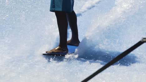 Skilled-surfer-carves-on-wave-machine