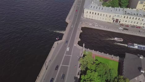 Saint-Petersburg,-an-aerial-drone-footage-of-central-park-Summer-Garden,-boats-under-the-bridge-in-a-river,-channel,-Church-of-Savior-on-Blood,-Castle,-center-of-Saint-Petersburg