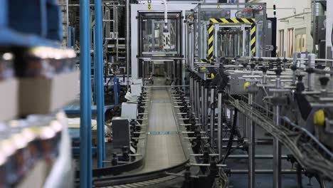 Panning-shot-of-idle-convernyor-belt-in-a-large-factory