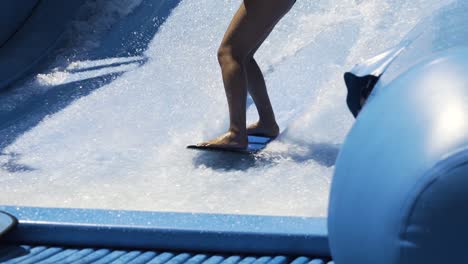 Surfing-wave-machine-slow-motion,-close-up-on-feet