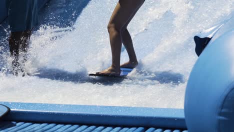 Surfing-wave-machine,-close-up-on-feet